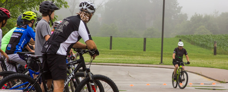 Participants at Mountain Biking 101 skill class receiving instruction